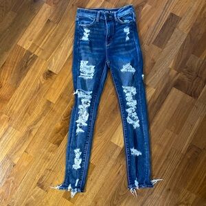 American Eagle four pocket, distressed blue jeans